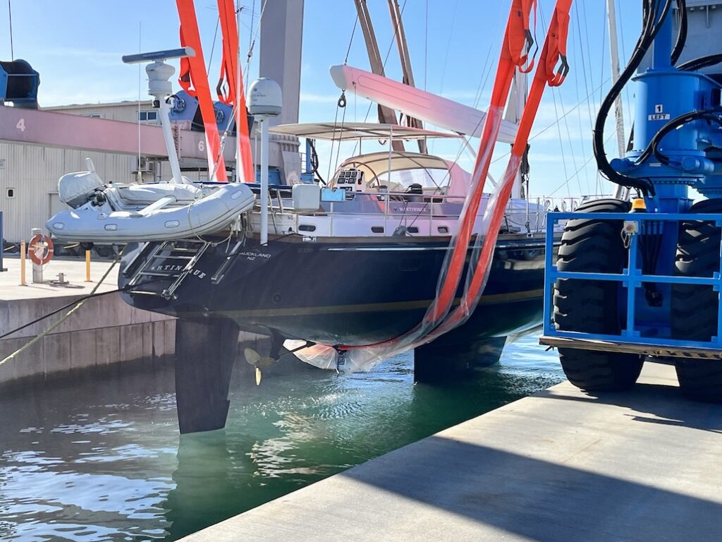 A leisure craft yacht in the slings awaiting an inspection.